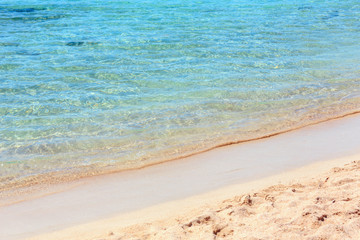Sea surf on beach.