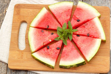 Slices of fresh watermelon with ice and mint. Selective focus