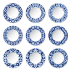 Set of decorative plates with a circular blue pattern, top view. White background. Vector illustration.