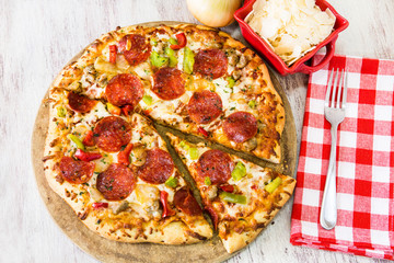 Pepperoni Pizza With Vegetables and Parmesan Cheese From Above