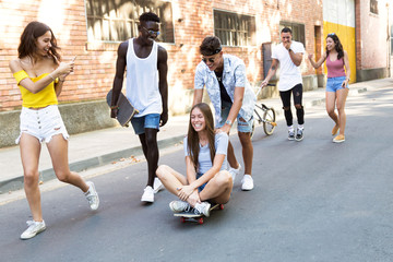 Group of active teenagers making recreational activity in an urban area.