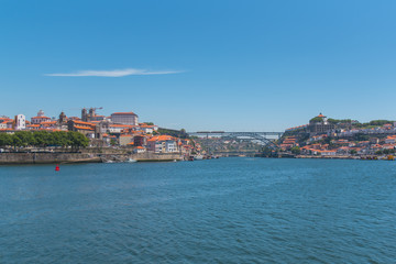 Porto, Portugal, panorama of Dom Luis bridge, the river Douro and tiles roofs
