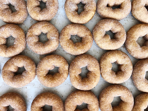 overhead of fresh cinnamon donuts, iphone 7 image