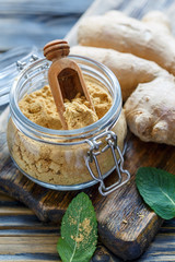 Ground ginger in a glass jar.