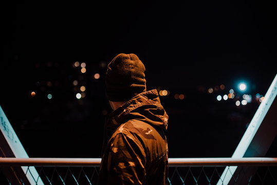 Backside view of a man on the bridge