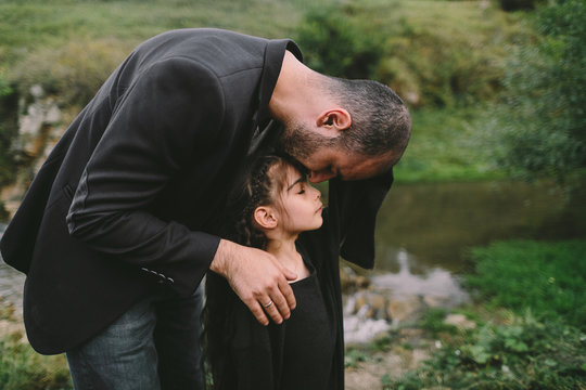 Father comforting daughter