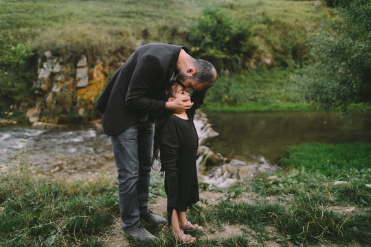 Father comforting daughter