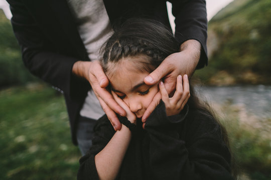 Father comforting daughter