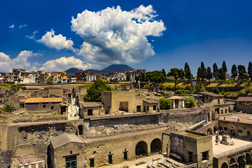 Italy. Ruins of Herculaneum (UNESCO World Heritage Site) - general view. There is Mount Vesuvius in the background