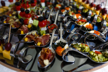 Snacks with Shrimps in Spoons on Buffet Table