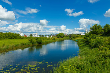 Fototapeta na wymiar Nature of Central Russia. Three monasteries of Suzdal and the river Kamenka. From left to right: Pokrovsky monastery, Spaso-evfimiev monastery and the convent of St. Alexander.