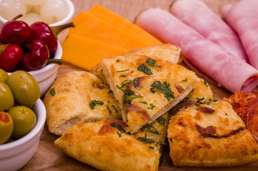 Antipasto Sharing Platter
A large wooden sharing platter of Antipasto.

