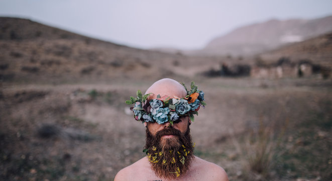 Man in desert with flower crown
