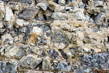 Old stone demolished wall background, abstract