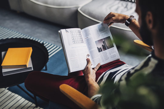 Man Holding Magazine