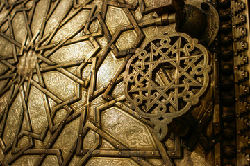 Fototapeta na wymiar Detail of a golden door in Fez Royal Palace, Morocco