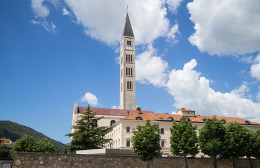Obraz premium Church of St. Peter & St. Paul, the Franciscan Monastery, and the Peace Bell Tower in Mostar, Bosnia and Herzegovina.