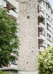 A bullet-pocked wall in a block of flats near the Peace Tower, Mostar, Bosnia and Herzegovina