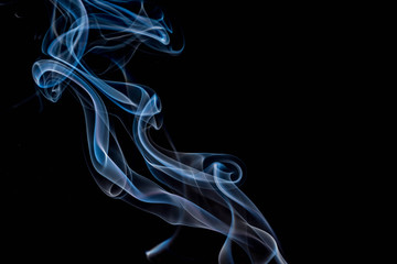 Obraz premium multi-colored smoke on an isolated black background