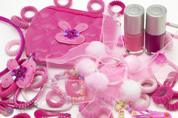 Pink fashion girly hair and nail accessories: clips, band and ribbons, pins and bow. Teenager hair clippers and grips. Little girl, girlie feminine fashion style. Nail polish bottles, cosmetic bag.