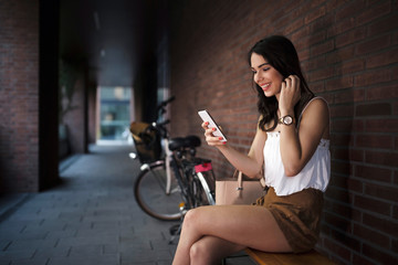 Portrait of attractive young girl using mobile phone