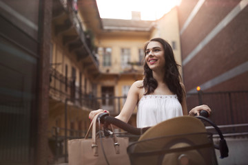 Portrait of beautiful young woman enjoying time on bicycle
