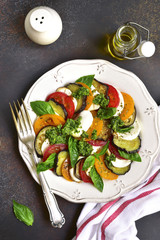 Traditional italian salad caprese with eggplants.Top view.