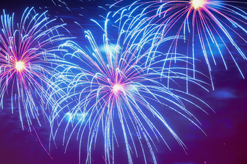 Close-up of vivid blue fireworks with sparks. Explosive pyrotechnic devices for aesthetic and...