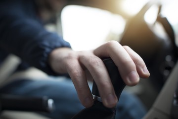 Driver with Hand on Stick Shift