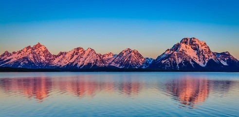 The majestic Grand Tetons in Wyoming remain clad in snow although spring has arrived. The beauty of...