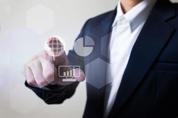 Future of financial business concept,Businessman touching increasing graph with finance symbols.
