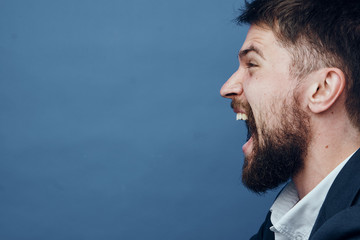 Fototapeta premium Business man with a beard on a blue background
