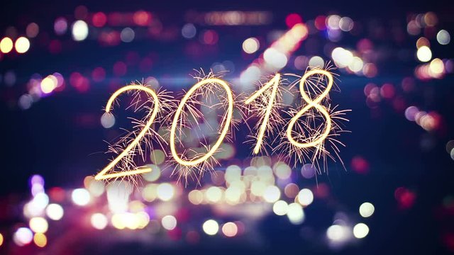 2018 new year sparkler text and city bokeh lights. Last 5 seconds are loopable. 4k (4096x2304)
