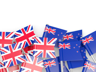Flag pins of United Kingdom and New Zealand isolated on white
