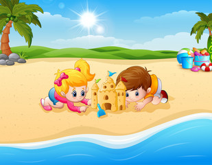 Obraz na płótnie Canvas Kids making sand castle at the beach