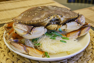 Dungeness crab with green onions and glass noddles
