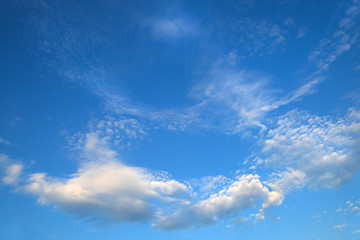 Beautiful background with light white clouds on blue sky