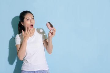 attractive woman looking at donut sugar food