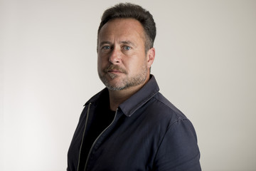 Man in Navy Blue Jacket Over Gray Background