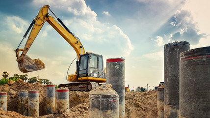 excavator blue sky heavy machine construction site soil excavate for foundation work by...