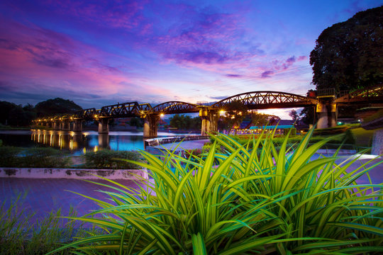 colorful twilight time of river khaw bridge in kanchanaburi most popular world war II history traveling destination in western of thailand