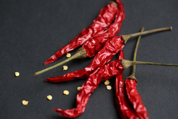 Dried red pepper on the black background.