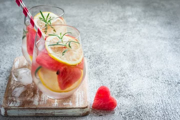 Fototapeten Watermelon lemon cocktail with pieces of watermelon in shape of heart. Valentine's Day Concept © colnihko