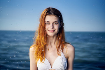 Young beautiful woman on vacation at sea, ocean, water, summer