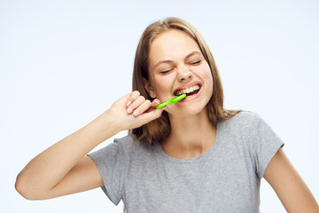 Young woman on white isolated background holds a spinner