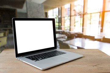 Fototapeta premium Laptop with blank screen on table.Blur a background