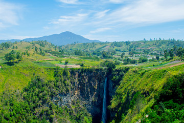 Fototapeta na wymiar Sipiso-piso waterfall, is one of the tallest waterfall in Indonesia. The name Sipiso-piso mean ‘like a knife' it has 120m high and it located in Tonggiang village, 45 Kilometers from Berastagi.