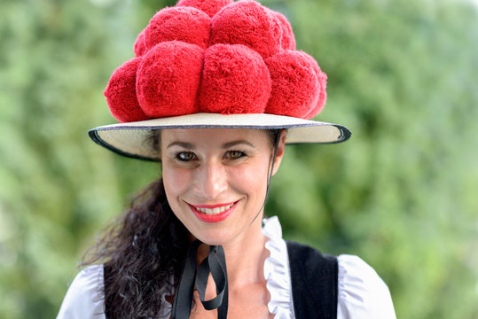 Attractive woman wearing a traditional Bollenhut