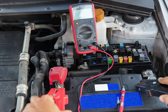 Check The Car,Electrician Measuring Voltage In Distribution Board, Closeup