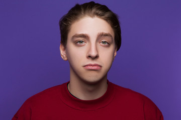 Disappointed young man. Dissatisfaction emotion. Sad and unimpressed handsome male, facial expression concept